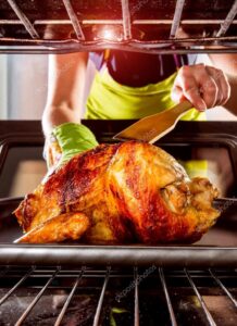 depositphotos 95174968 stock photo housewife prepares roast chicken