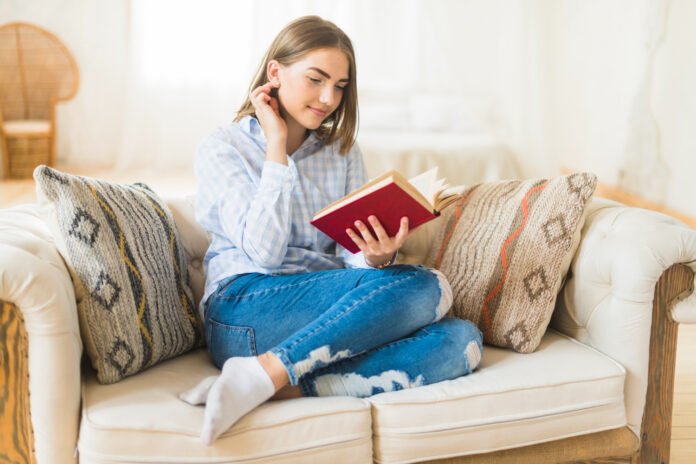 smiling beautiful woman reading story book