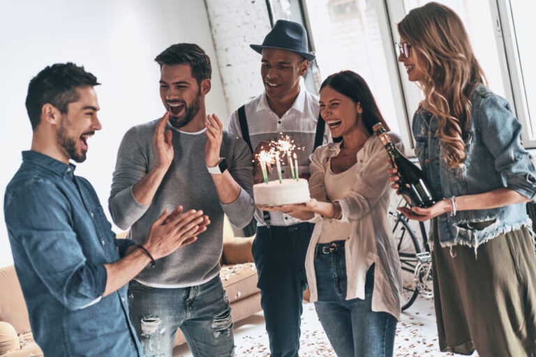 make,a,wish!,happy,young,man,celebrating,birthday,among,friends