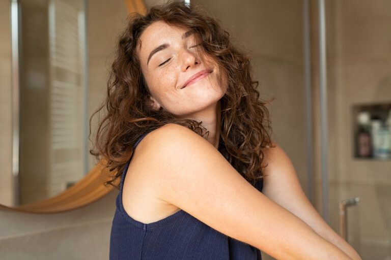 happy,young,woman,feeling,relaxed,with,eyes,closed.,smiling,woman