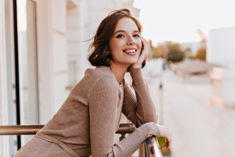adorable dark eyed girl laughing balcony photo cheerful caucasian woman with beautiful smile