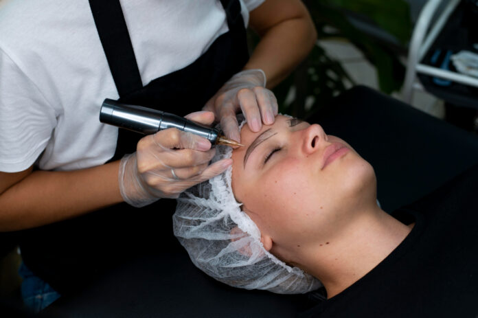beautician doing microblading procedure woman beauty salon
