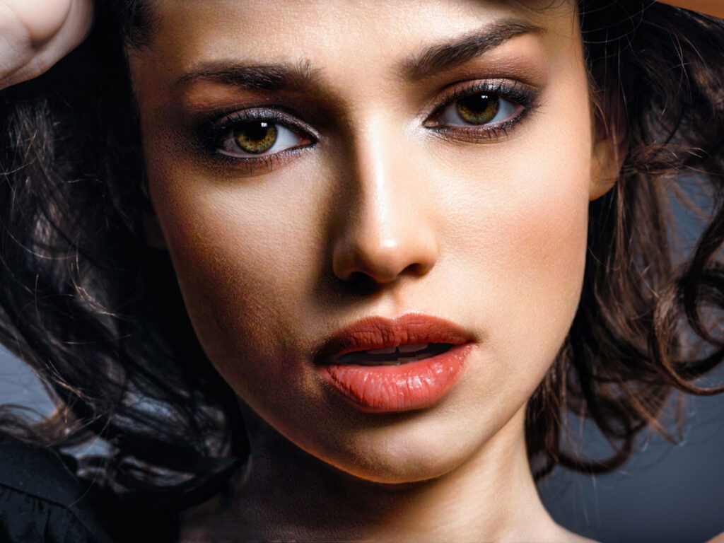 beautiful brunette woman with brown eyes fashion model with smokey makeup closeup portrait pretty woman looks camera
