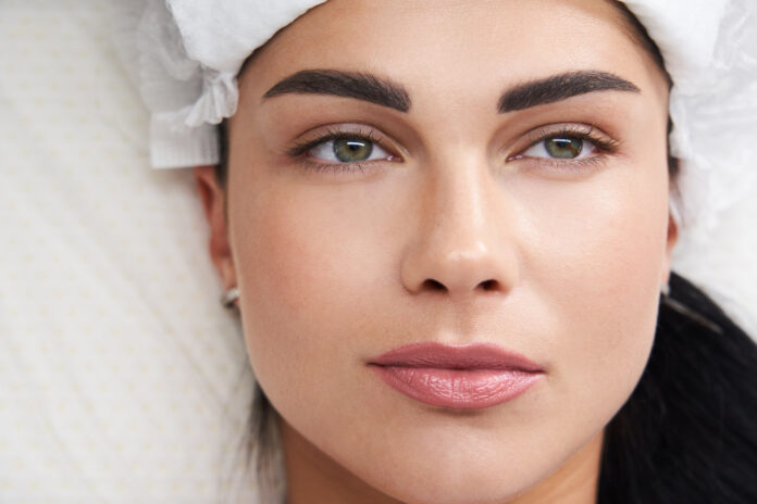 beautiful woman laying cosmetologist spa salon