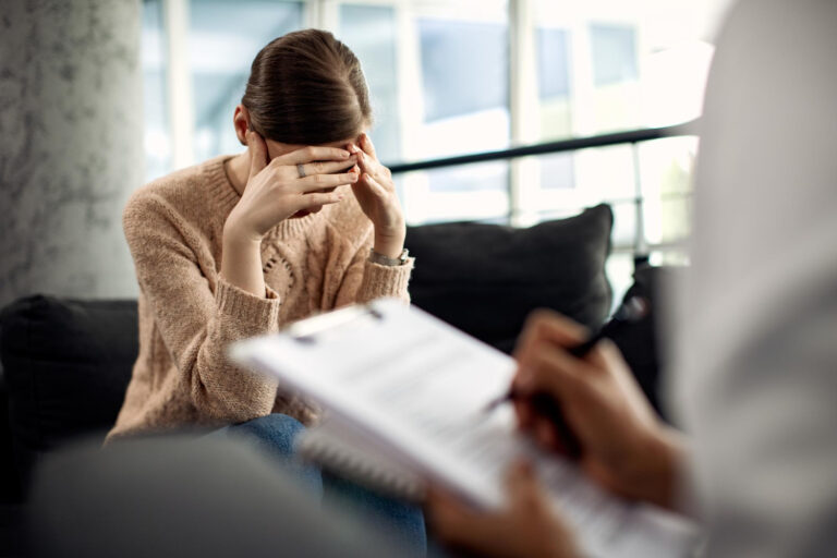 depressed woman having psychotherapy session doctor s office