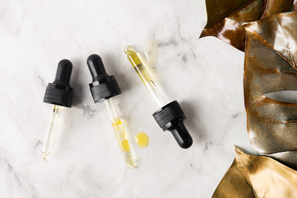 flat lay different pipettes marble background