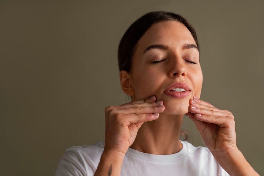 portrait young woman practicing facial yoga youth