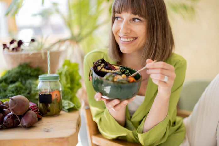 relaxed woman with healthy food room with plants