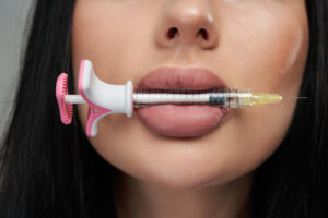 unrecognizable beautiful female face with small pink syringe mouth close up attractive womans