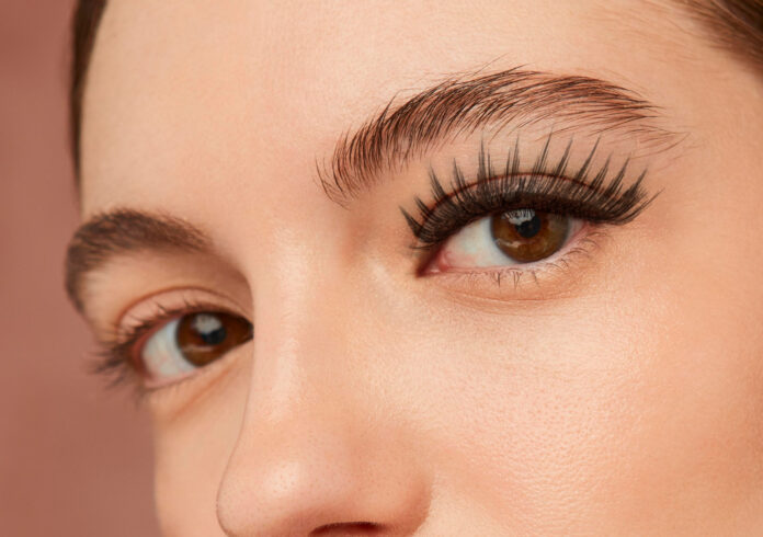 woman with eyelashes extension side view