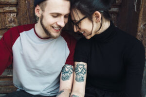 young beautiful couple posing old building