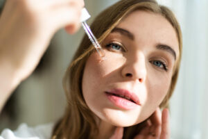 young woman doing skin care