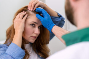 woman getting hair loss treatment clinic