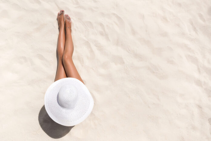 summer,holiday,fashion,concept, ,tanning,woman,wearing,sun,hat
