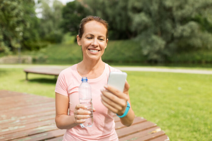 sport,,technology,and,healthy,lifestyle,concept, ,happy,woman,with