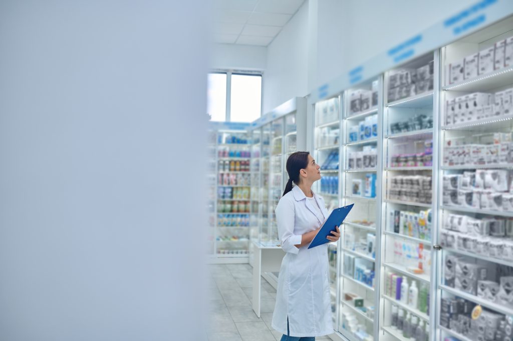 pharmacist checking medicines in a drugstore